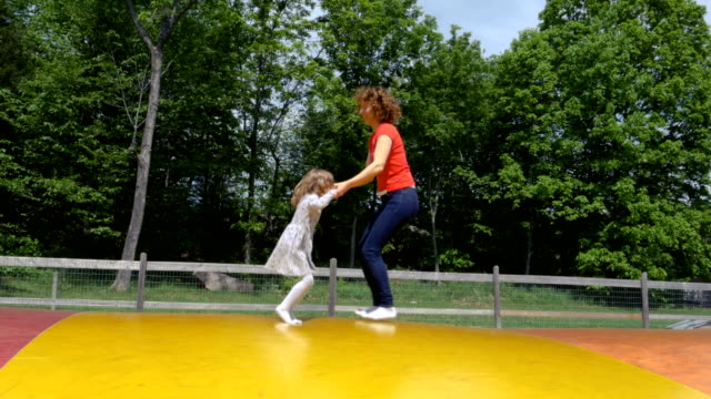 Mother-and-Daughter-Playing-on-a-Jumping-Pillow-2