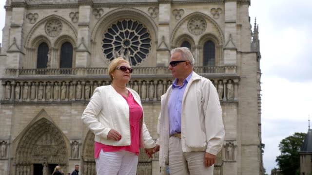 Senior-couple-in-front-of-Notre-Dame-in-Paris-in-4k-slow-motion-60fps