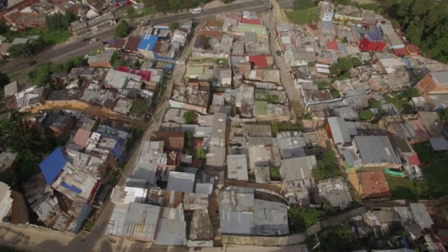 Aerial-circling-around-a-shanty-town-in-downtown-Bogota,-Colombia
