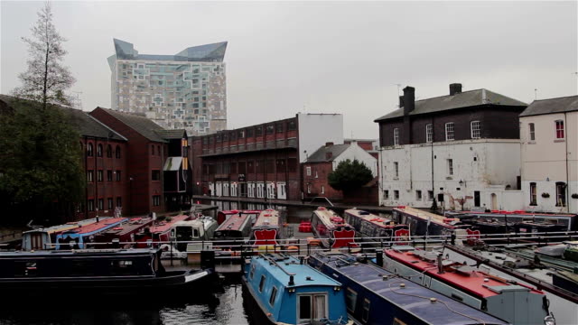 Wide-View-of-The-Cube-Building-and-Narrow-Boats-Docked-in-Canal-Harbor