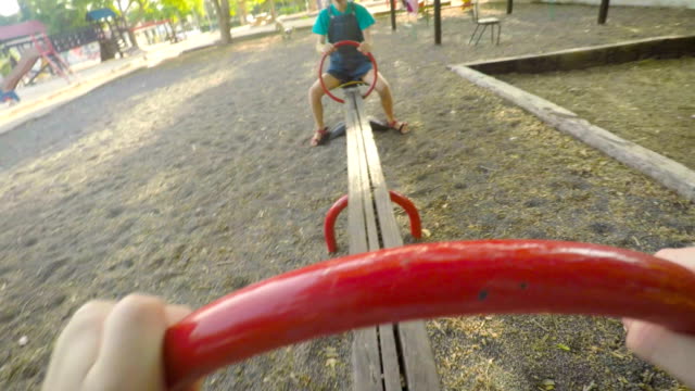 POV-footage-of-three-kids-playing-in-a-playground