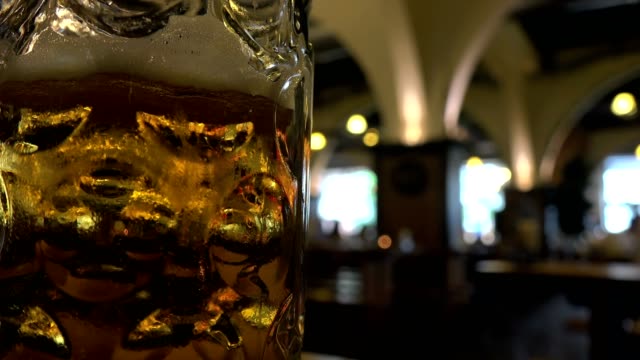 German-Beer-house,-focus-pull-on-close-up-of-stein-of-beer