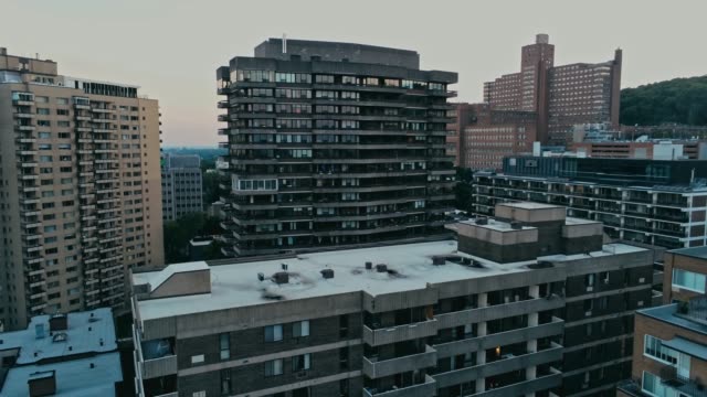 Aerial-footage-of-rundown-highrises-during-a-hazy-summer-day