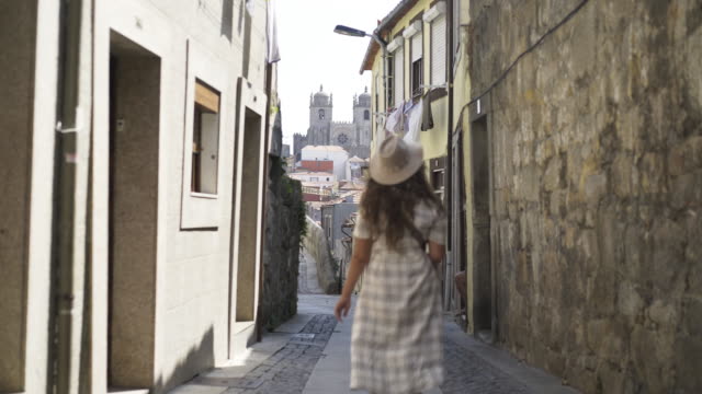 Following-girl-on-narrow-street