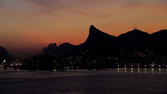 Low-angle-aerial-view-of-Rio-de-Janeiro-Corcovado-Hill-at-Dusk,-Brazil