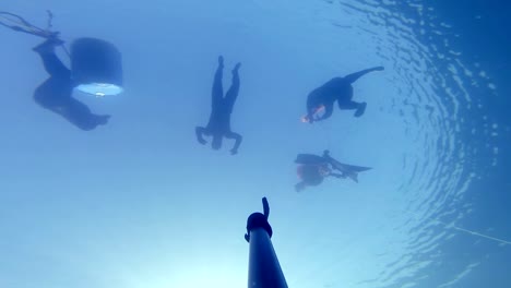 Camera-Falling-Down-and-Showing-3-Divers