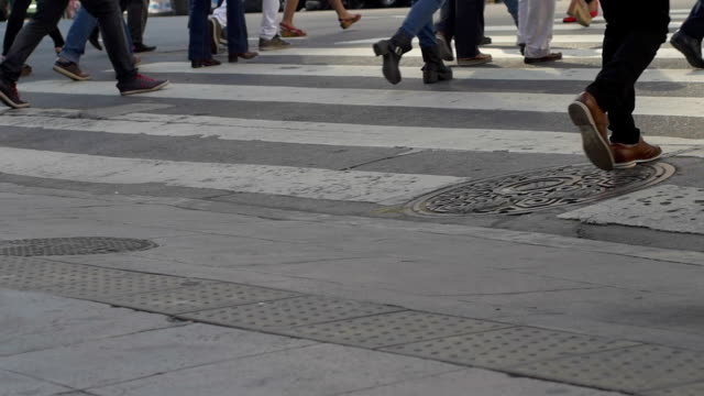Feet-crossing-Florida-street-in-downtown-Buenos-Aires-in-slow-motion