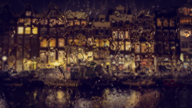 View-through-the-glass-with-raindrops-traditional-houses