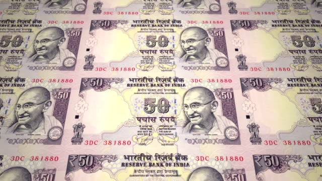 Banknotes-of-fifty-indian-rupees-of-India-rolling,-cash-money,-loop