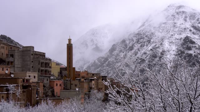 Berber-village-in-high-Atlas-mountaines,-Morocco.-Snow-covered-trees