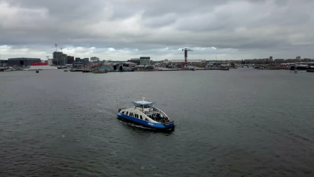 4k-Aerial-shot-orbiting-a-passenger-ferry-boat-in-Amsterdam