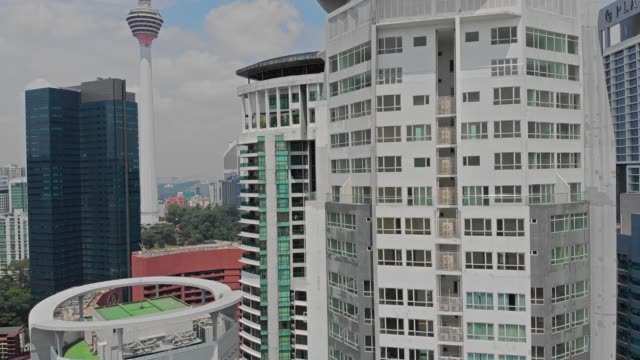 Aerial-view-Kuala-Lumpur.-Flight-close-to-buildings-and-skyscrapers-4K