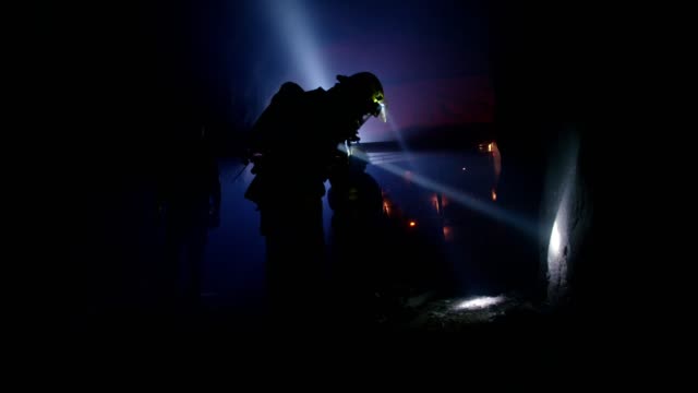 Firefighters-during-a-rescue-operation-in-a-dark-tunnel-filled-with-smoke