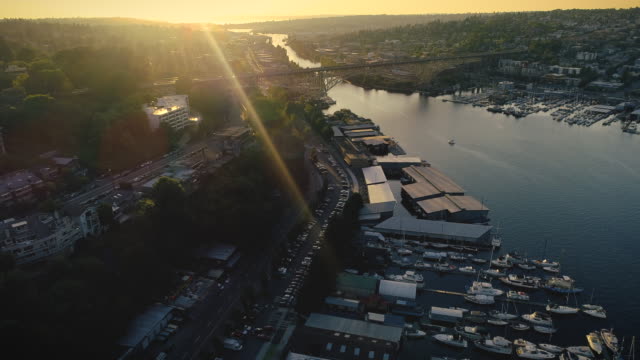 City-Waterfront-Canal-Bridges-Helicopter-Angle-at-Sunset