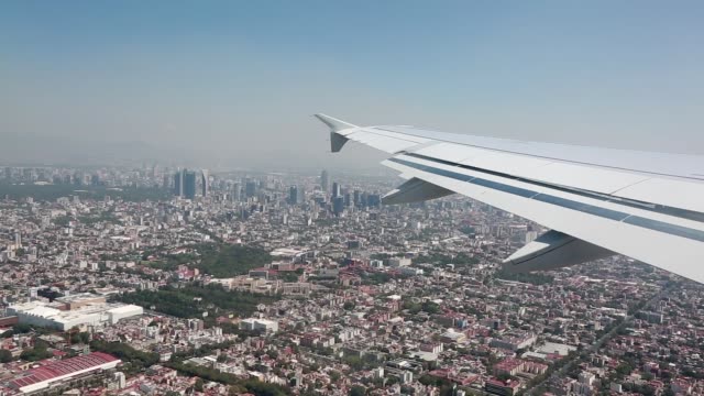 View-from-an-airplane-as-it-lands-in-Mexico.--Homes-and-buildings-can-be-seen.