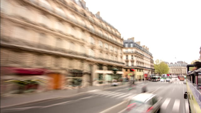 View-from-moving-touristic-bus-on-road-and-buildings-is-Paris,-France,-timelapse