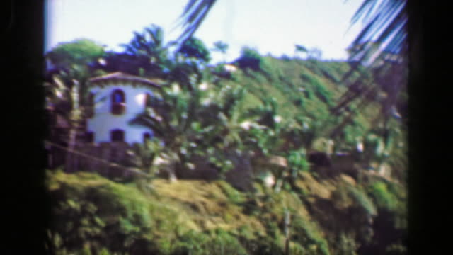 1952:-Wealthy-villa-houses-in-tropical-setting-mountain-cliff-overlooks.