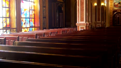 Wooden-Pews-in-a-Christian-Church-Aisle