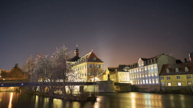 Star-time-lapse-over-Bamberg-Old-Town-Hall-at-night