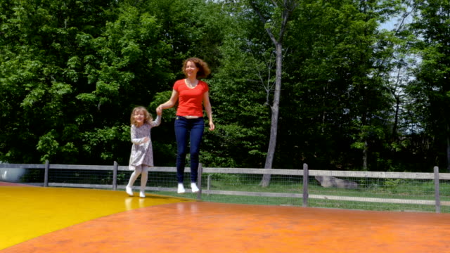 Mother-and-Daughter-Playing-on-a-Jumping-Pillow-3