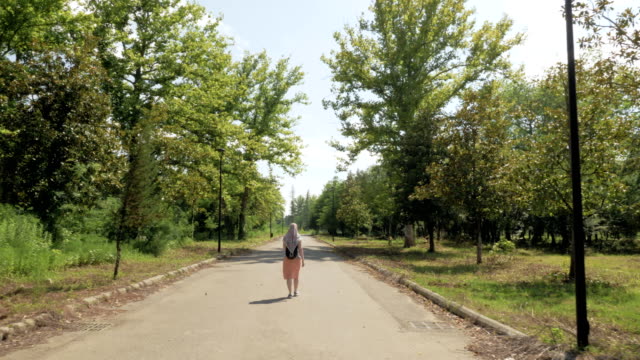 Woman-walks-in-the-park,-Tskaltubo,-Georgia