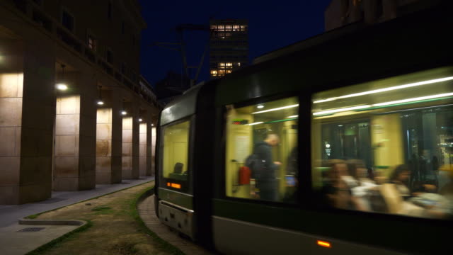 Italy-night-illuminated-milan-famous-tram-traffic-street-crossroad-panorama-4k