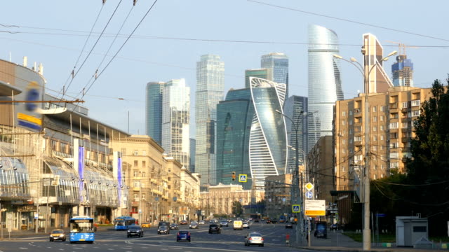 Traffic-on-morning-street-with-skyscrapers-on-background.-Moscow,-Russia.