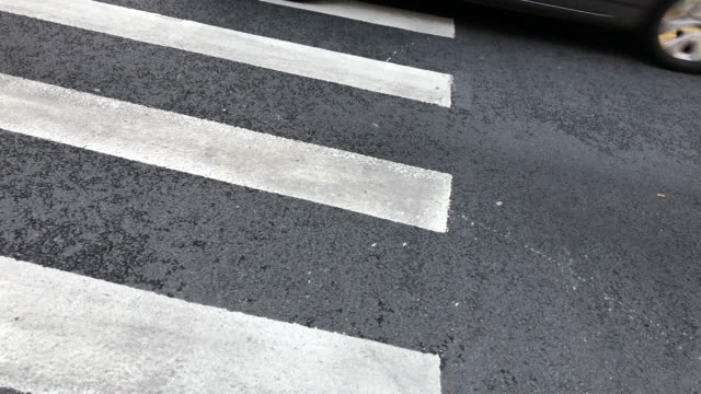 Cars-passing-by-on-crosswalk