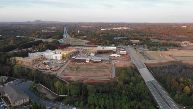Flying-over-new-mall-construction-next-to-condos-and-highway-in-Atlanta-Suburbs
