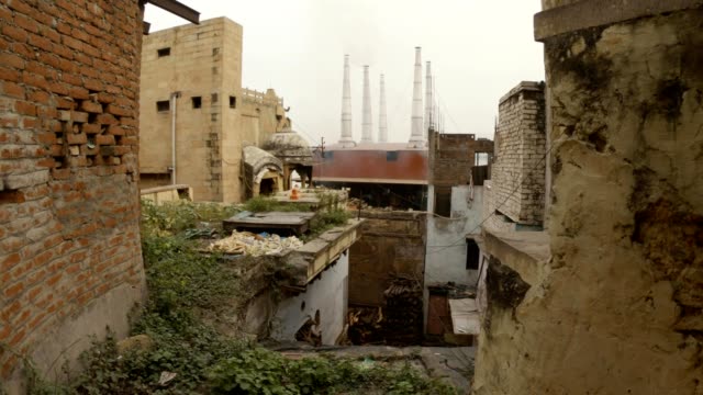 Puff-of-smoke-belch-from-chimneys-of-crematory-Manikarnika-Ghat-view-from-slums