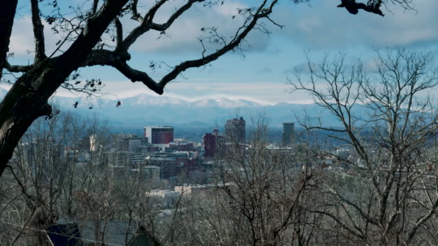 Dolly-shot-of-downtown-Asheville,-NC-during-the-winter