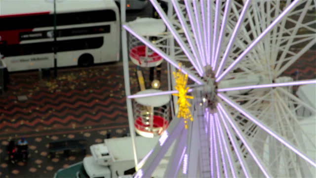 Pull-Focus-Aerial-Shot-Ferris-Wheel-Cars-Spinning---Christmas-Attractions-Lights