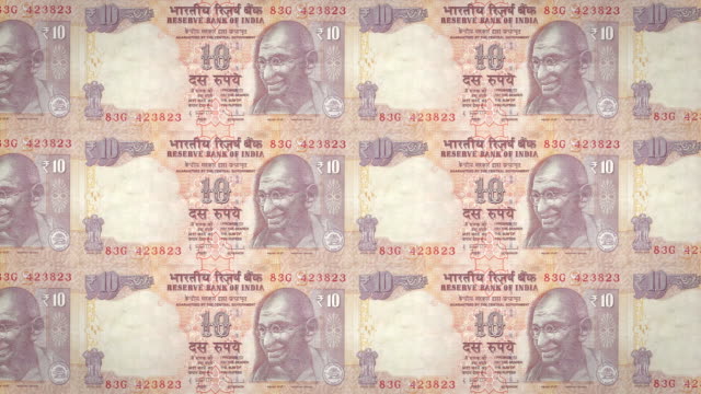 Banknoten-der-zehn-indischen-Rupien-Indiens-Rollen,-Bargeld,-Schleife