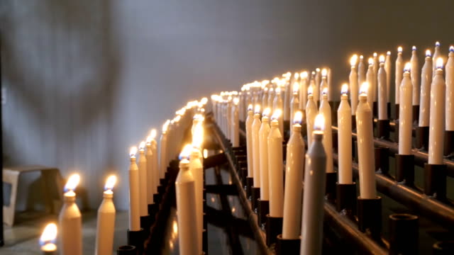 Many-burning-candles-in-christian-church