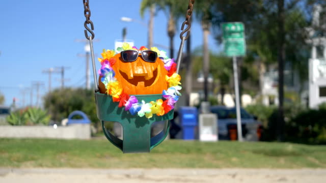 Happy-Halloween-pumpkin-on-the-swing-in-4K-Slow-motion-60fps