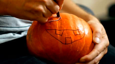 carve-a-pumpkin-for-Halloween-with-a-knife