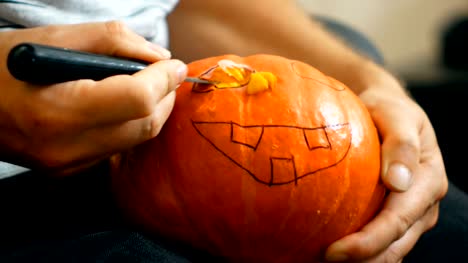 carving-a-Halloween-pumpkin-with-a-knife
