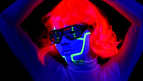 Woman-with-UV-cyborg-face-paint,-wig,-glowing-clothing-portrait-face-close-up-of-make-up.-Asian-woman.-.