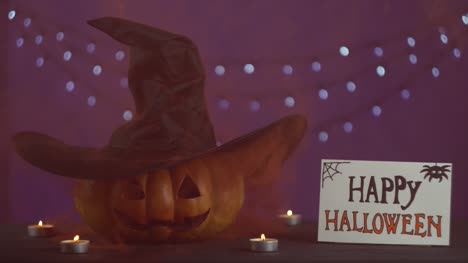 From-the-pumpkin-goes-smoke.-Jack's-head-pumpkin-with-hat-in-dark