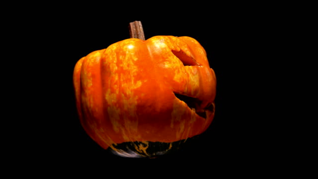horrible-and-terrible-burning-pumpkin-with-cut-out-eyes