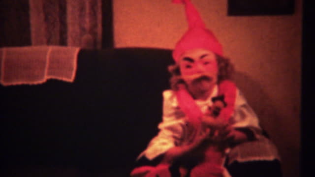 1940:-Creepy-Halloween-costume-on-cute-girl-takes-off-mask.
