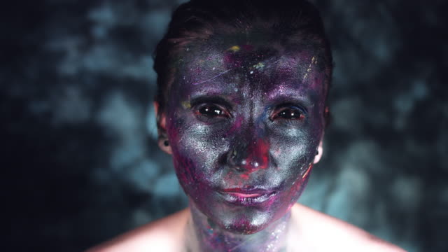 4k-Cosmic-Shot-of-a-Woman-with-Alien-make-up-Blowing-Air