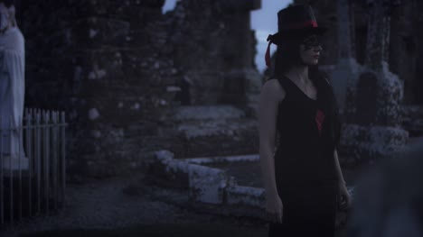 4k-Halloween-Shot-of-a-Witch-Walking-in-the-Cemetery