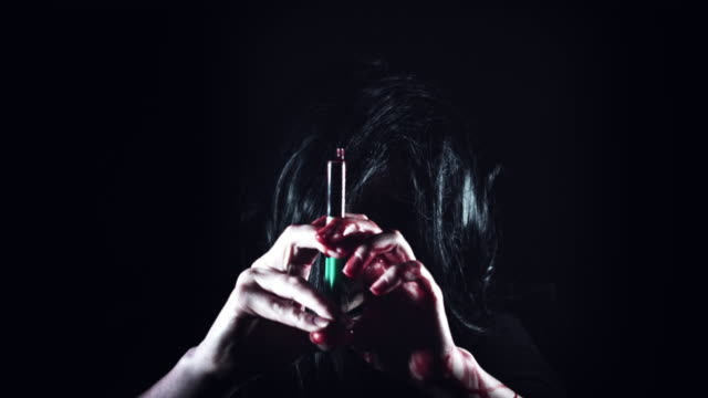 4K-Horror-Creepy-Woman-Holding-Injection-with-Blood