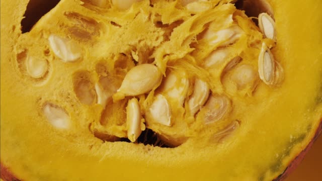 Halloween-colorful-hokkaido-pumpkin---stop-motion-animation.-Healthy-vegetable-raw-food-preparing---extreme-close-up-view.