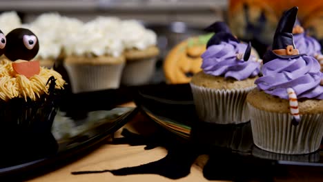 Cupcakes-with-icing-hat-and-legs.-Delicious-Muffin-like-witch.-Halloween-concept