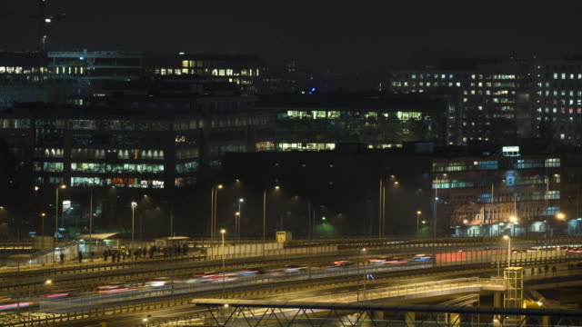 Night-time-lapse-of-office-building-in-Warsaw-and-busy-streets