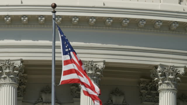 extreme-close-up-of-the-flag-on-the-us-capitol-building-in-washington