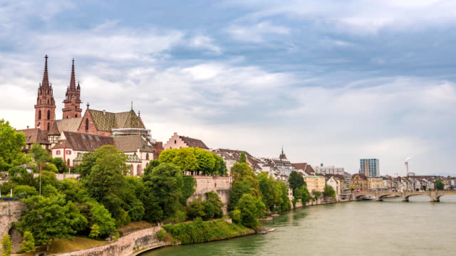 Basel-city-skyline-timelapse-and-Rhine-River,-Basel,-Switzerland-4K-Time-lapse