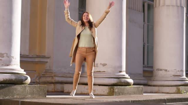 Businesswoman-Funky-Dancing-near-historic-palace